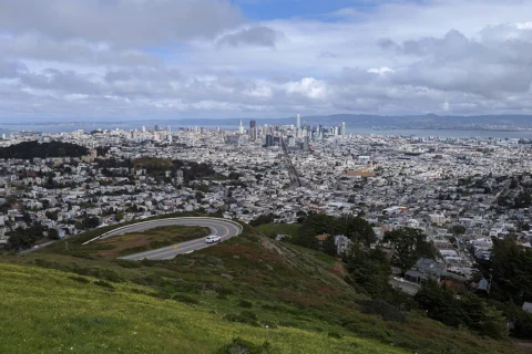 san-francisco-ca Panoramic view of San Francisco, California from Twin Peaks showing the cityscape and bay under cloudy skies.
